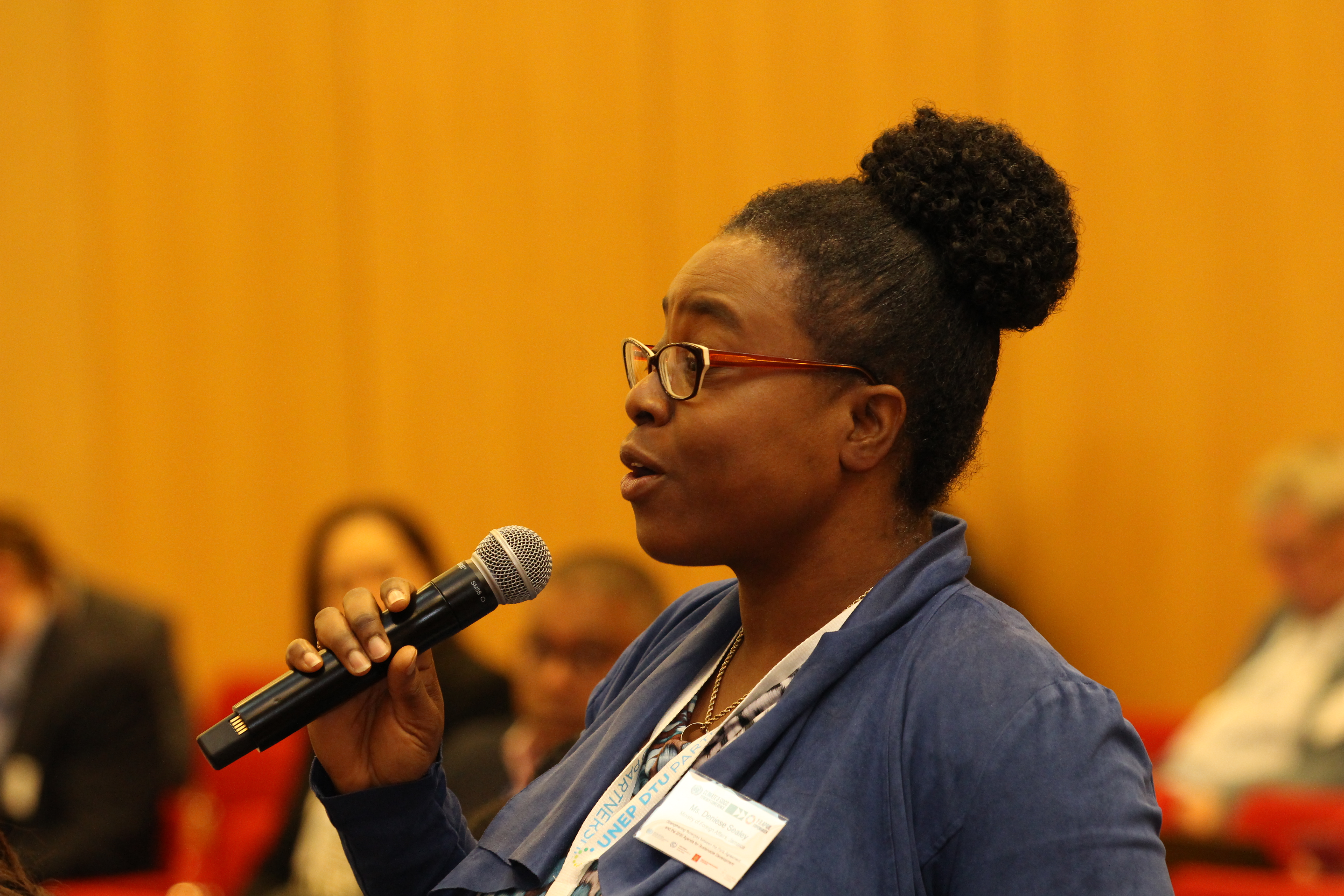 An audience member poses a question to panelists. (2)